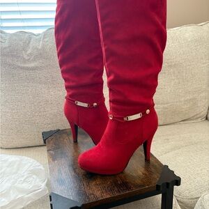 Striking Red Heeled Boots with Stiletto Design